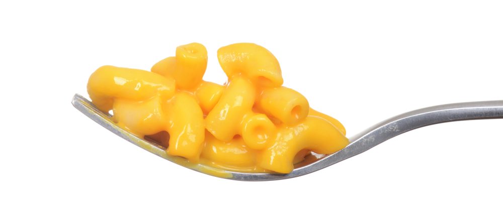 isolated macaroni and cheese on a fork