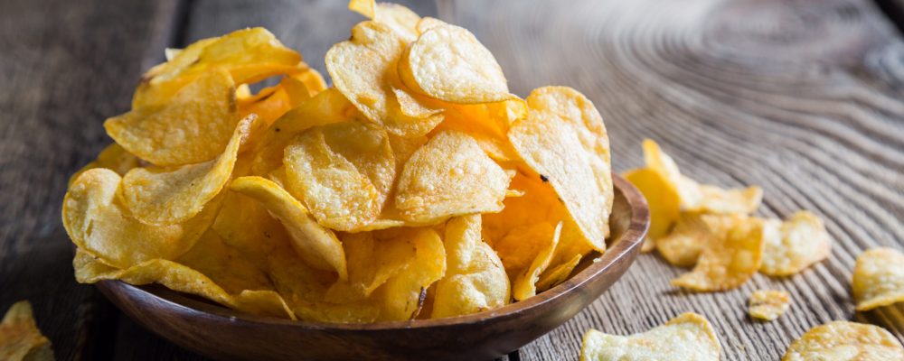 Potato chips on a wooden table