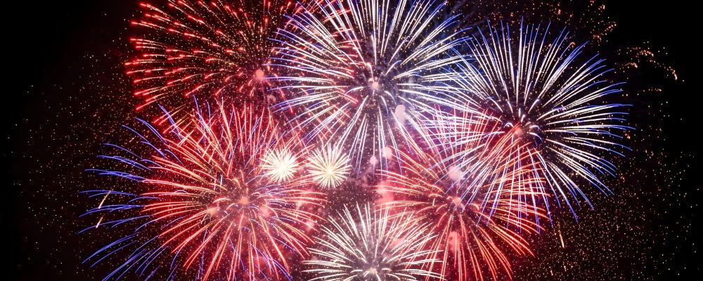 Vibrant red, White, And blue fireworks exploding in the night sky on 4th of July celebration, Perfect for American Independence Day festivities and patriotic events