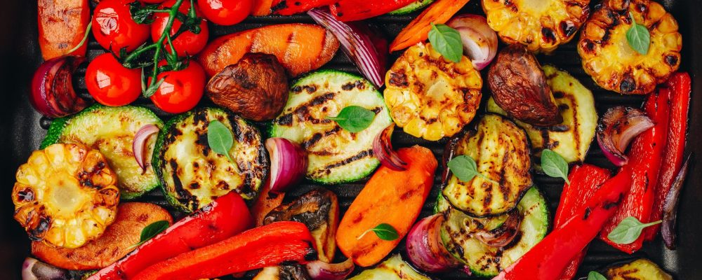 Grilled vegetables in a cast iron pan. Top view