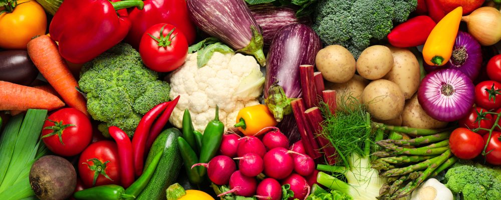 Different fresh vegetables as background, closeup view
