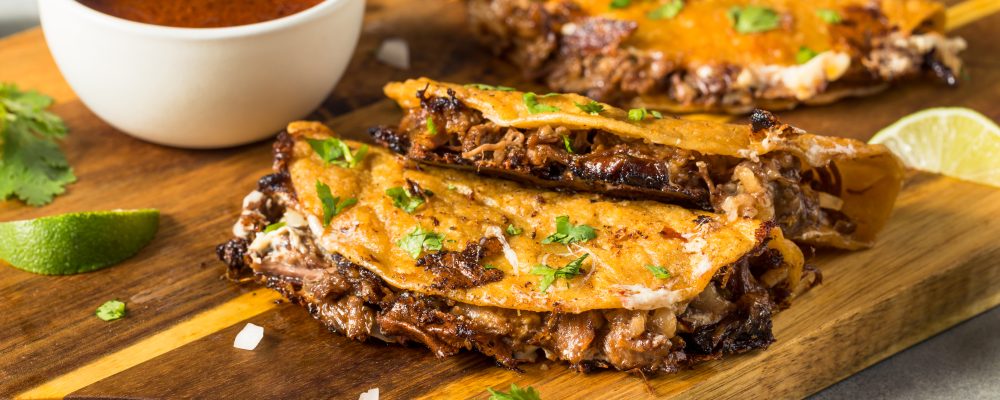 Homemade Steak Birria Meat Tacos with Cheese and Sauce