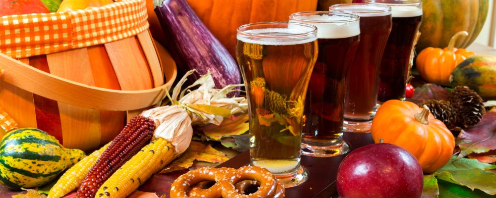 oktoberfest beer flight of four samples with fall seasonal decoration