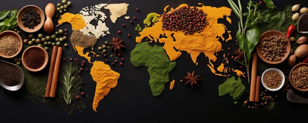 Spices and herbs around the world in the shape of a world map on a dark background. Top view. Creative photo banner