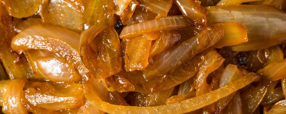 Brown Organic Caramelized Onions in a Bowl to Cook With