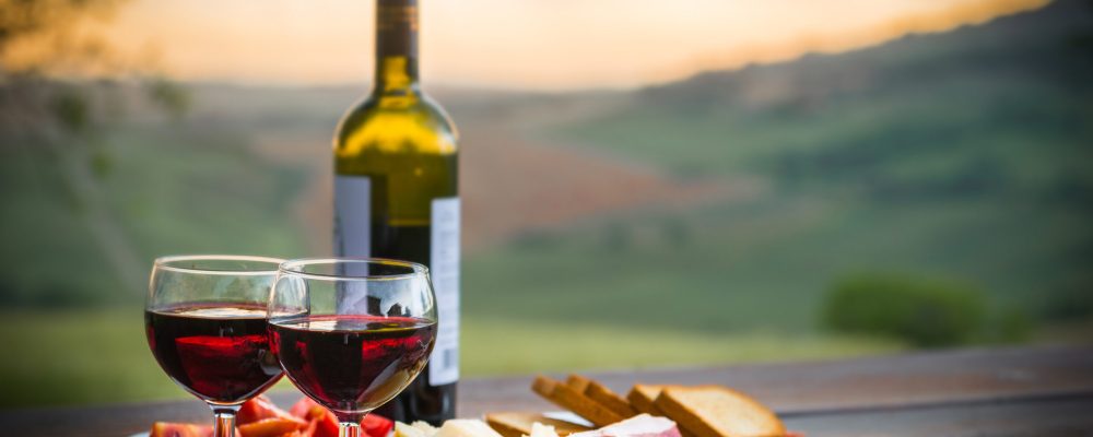 still life Red wine  ,cheese and prosciutto. Romantic dinner  outdoors