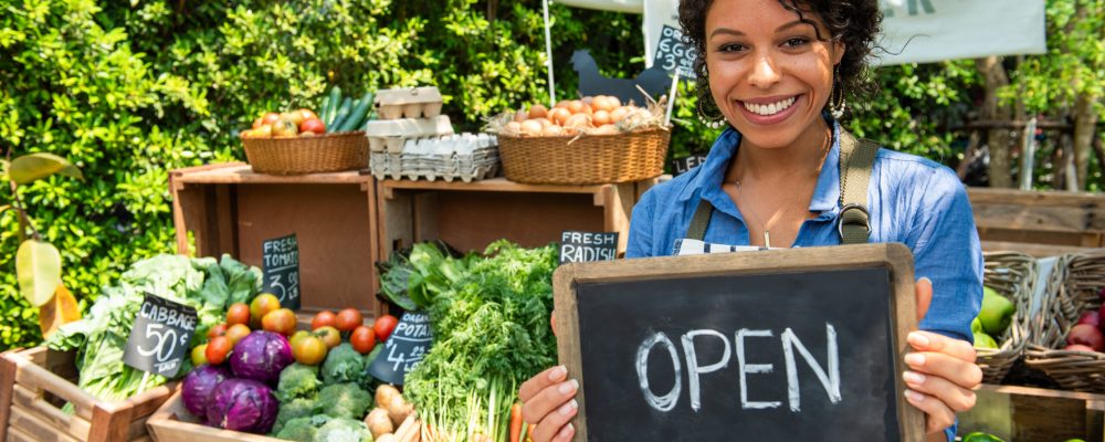 Smiling vendor at farmers market
